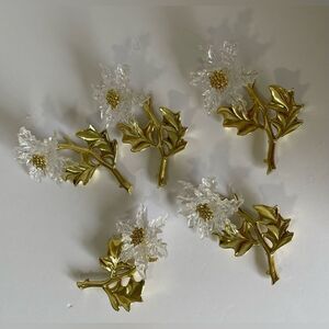 Set of 5 gold and clear floral Christmas ornaments.